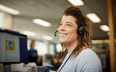 Cancer council staff helping people on the phone