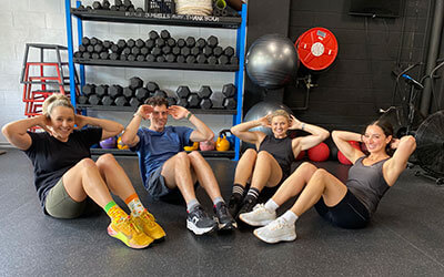 Team doing sit up fundraising challenge